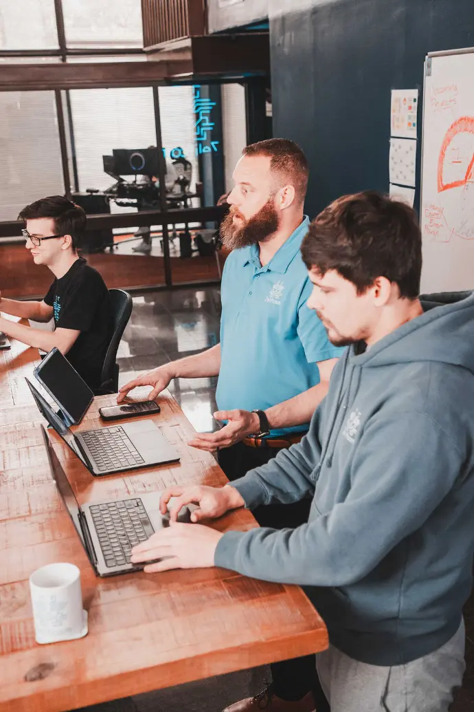 Zelifcam team members planning together at a worktable
