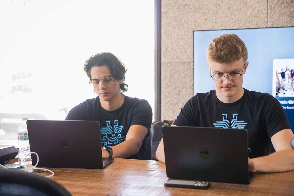 Two Zelifcam developers working at the San Antonio office